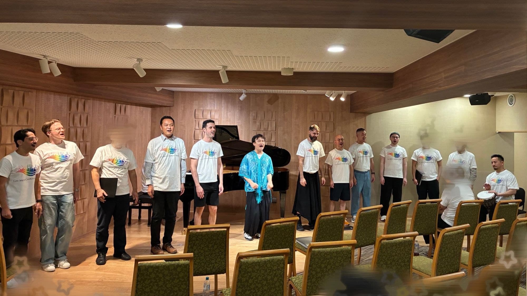 GMCT members singing in front of a piano